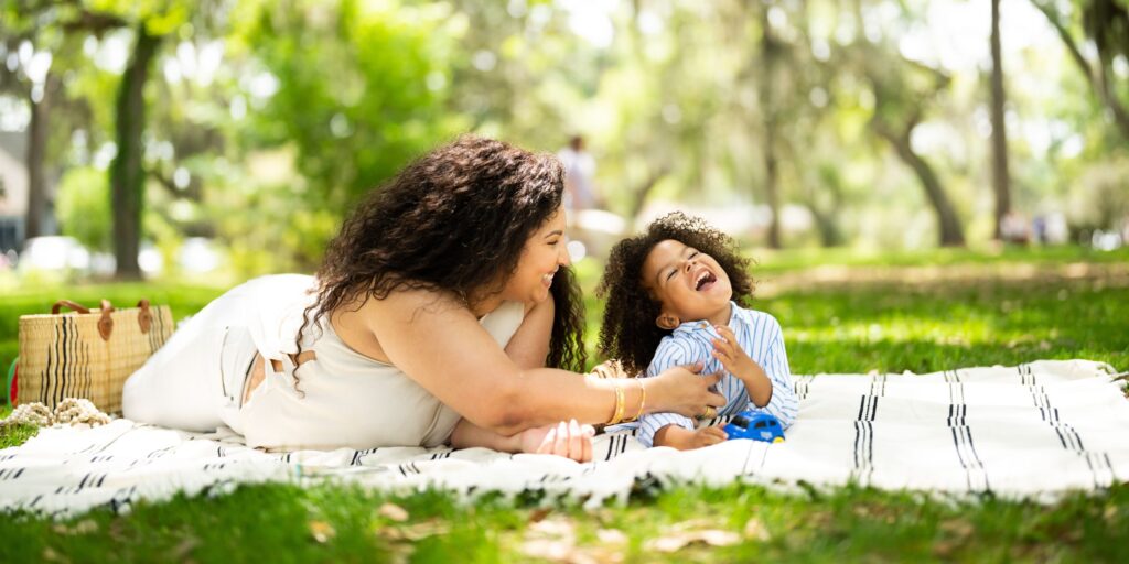 A mother and daughter having fun at a park