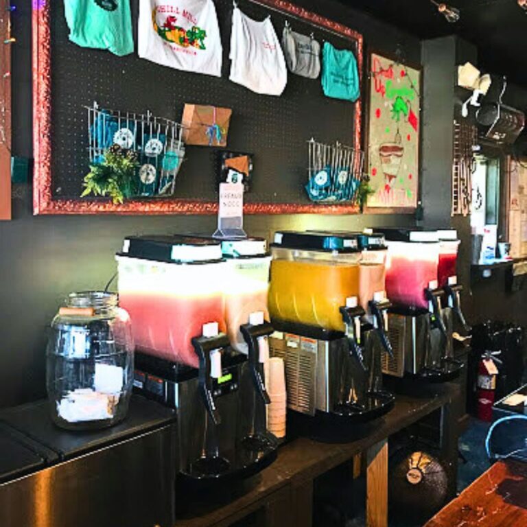 Frozen drink machines against a bulletin board with merchandise at The Chill Mill