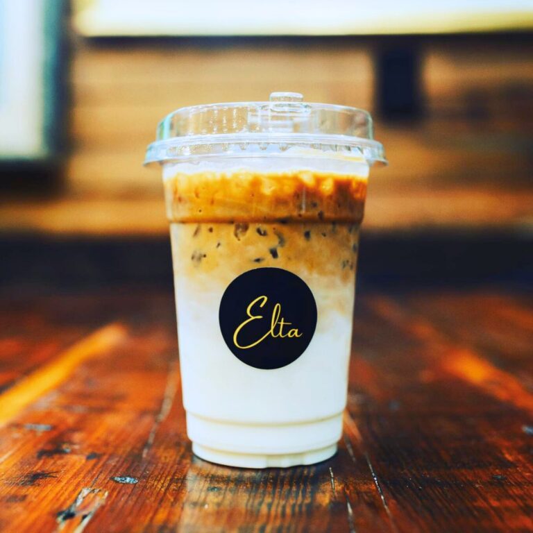 A cup of coffee with mik from Elta Coffee