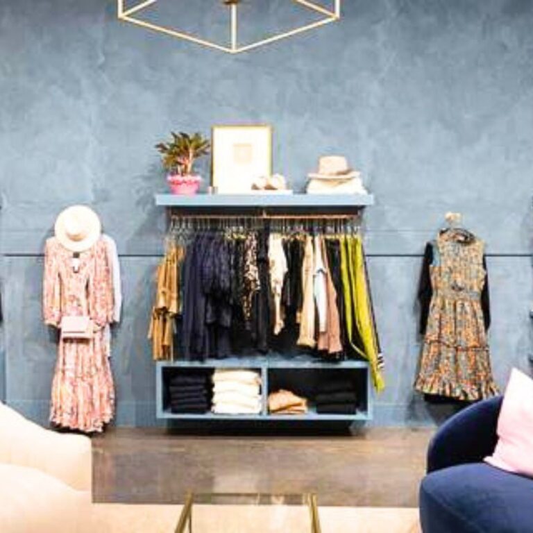 Clothing display with a blue wall at Barlow Fashion